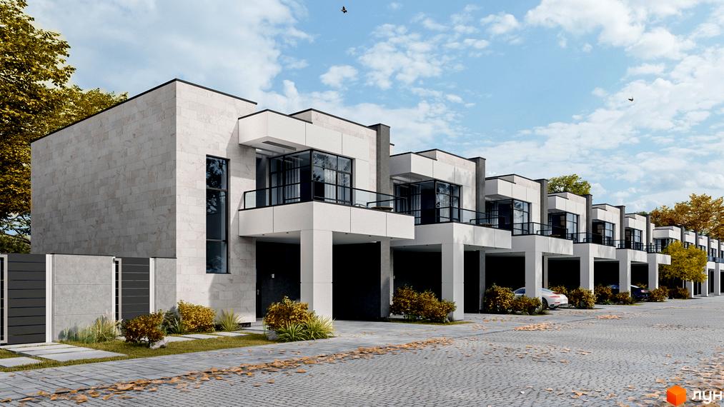 Фасад будинку в Котеджному містечку Family Park Residence з білими колонами та скляними балконами, бруківка та зелені насадження на прибудинковій території.