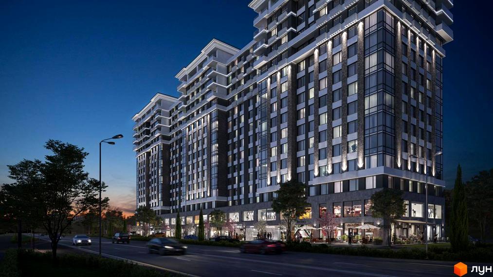 Висотна будівля ЖК River Plaza з великими вікнами та підсвіткою фасаду. На першому поверсі розташовані магазини та кафе, перед будинком дорога з автомобілями.