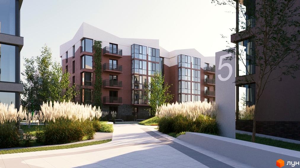 Зовнішній вигляд житлового комплексу Гордість з цегляними фасадами, великими вікнами та балконами. Прибудинкова територія озеленена високою травою та деревами.