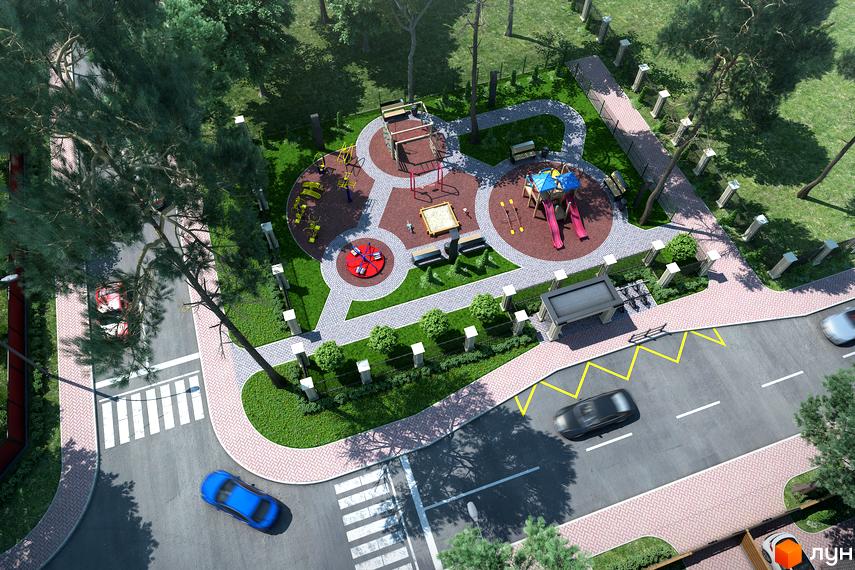 Житловий комплекс Monaco: дитячий майданчик з гірками, пісочницею та каруселлю, облаштована прибудинкова територія з лавочками та зеленими насадженнями.