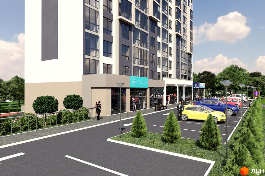 Зовнішній вигляд новобудови ЖК River Stone з парковкою та зеленими насадженнями. Фасад будівлі виконаний у світлих та сірих тонах, з великою кількістю скління.