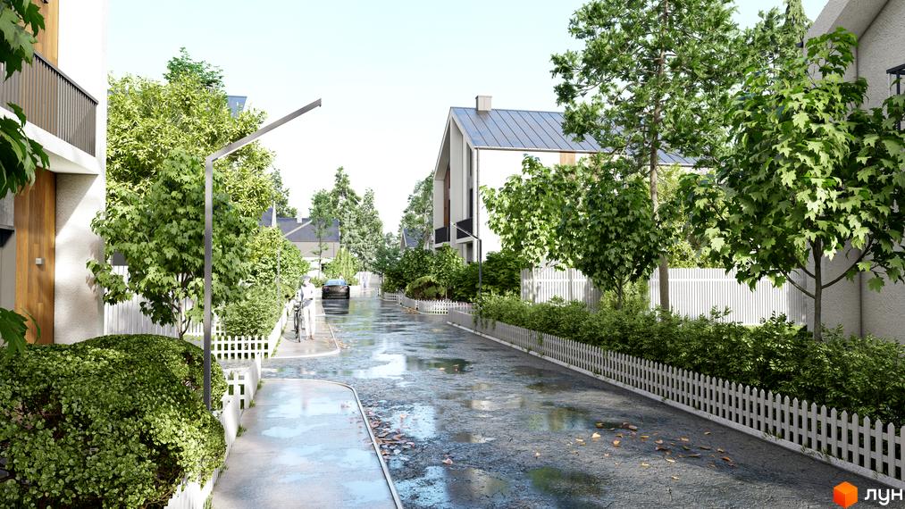 Котеджне містечко КМ В колі друзів: вулиця з будинками та зеленими деревами після дощу. Прибудинкова територія з парканом та доріжками.