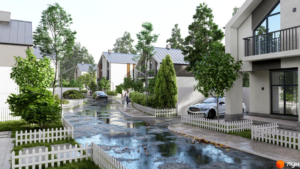 Котеджне містечко В колі друзів: світлі котеджі з сірими дахами, мокра дорога та зелені насадження з білими парканами.