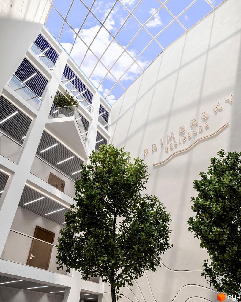 Інтер'єр житлового комплексу Primorsky Residence з багатоярусними балконами, скляним дахом та внутрішніми деревами.