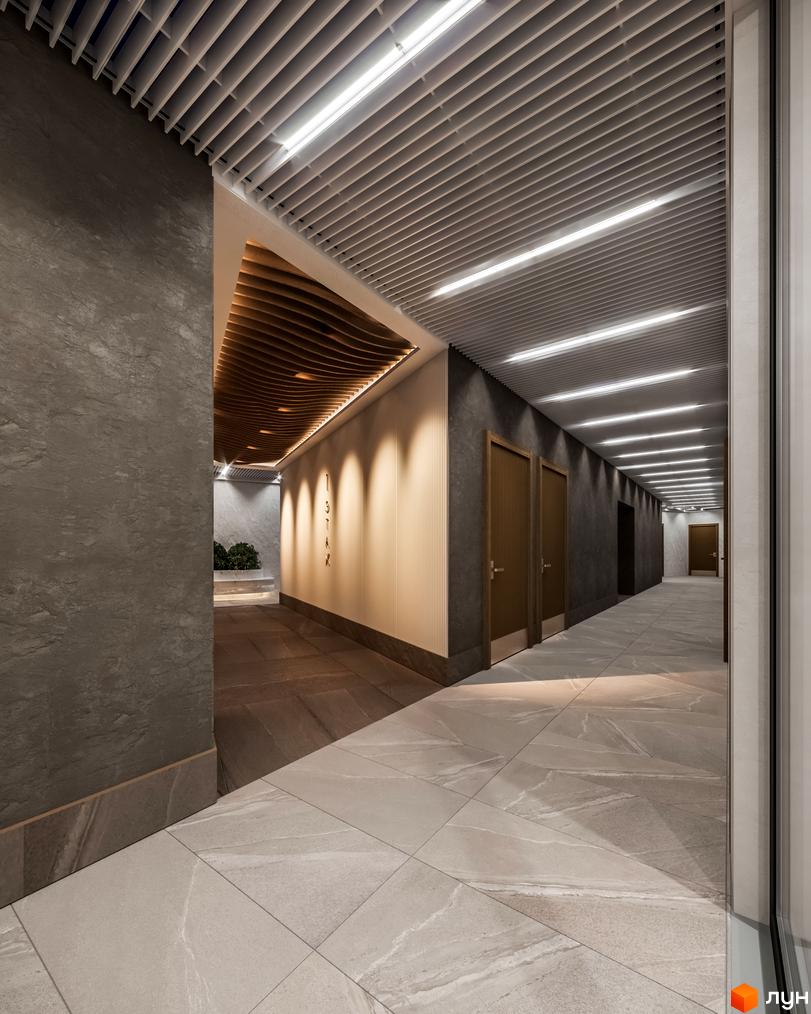 Інтер'єр коридору Апарт-комплексу Primorsky Residence: грильято стеля з лінійним освітленням, текстуровані стіни та плитка на підлозі.