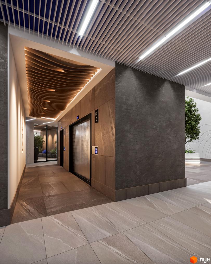 Інтер'єр холу з ліфтами в апарт-комплексі Primorsky Residence. Оздоблення стін та підлоги виконано з використанням каменю.