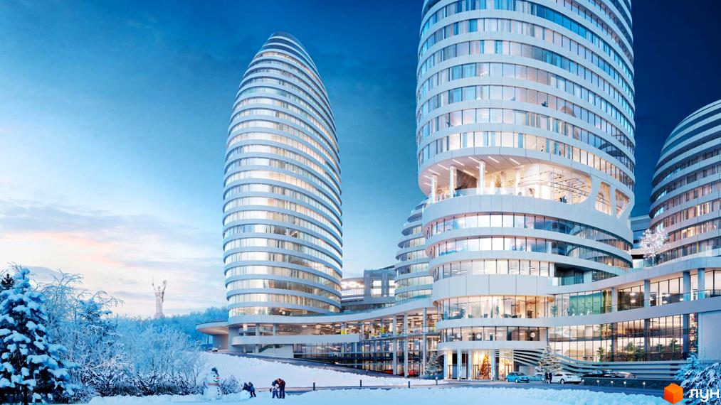 Багатоповерхові білі будівлі БФК INTERGAL CITY округлої форми з великими вікнами. Засніжена територія з деревами та людьми, що гуляють.