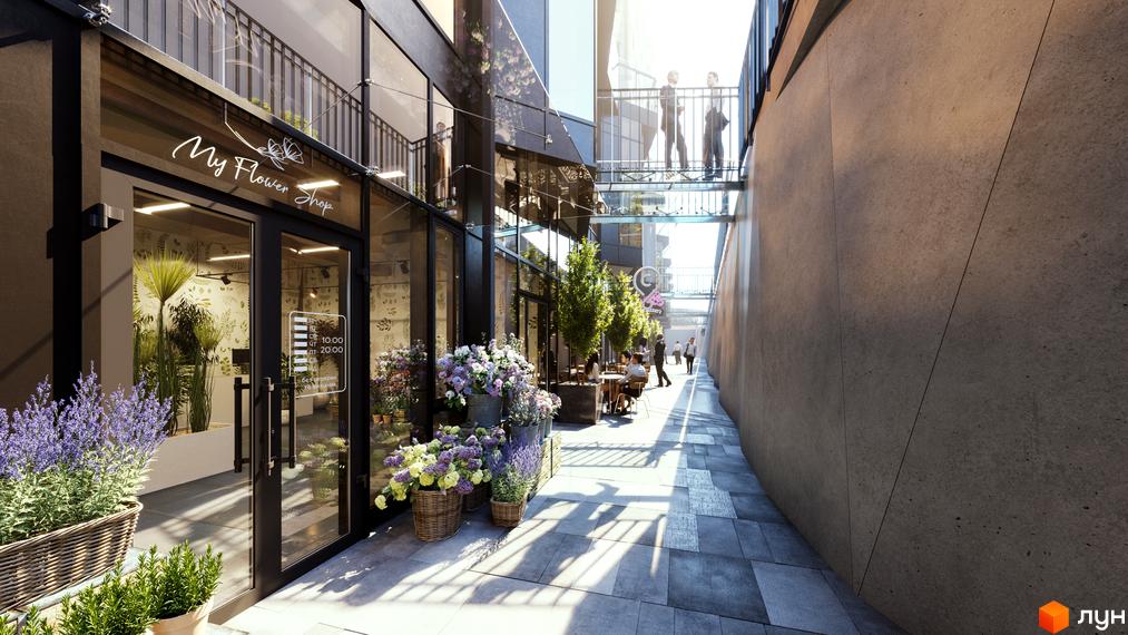 Житловий комплекс Fjord: пішохідна алея з квітковим магазином, літніми терасами та скляними переходами між будинками з темними фасадами.