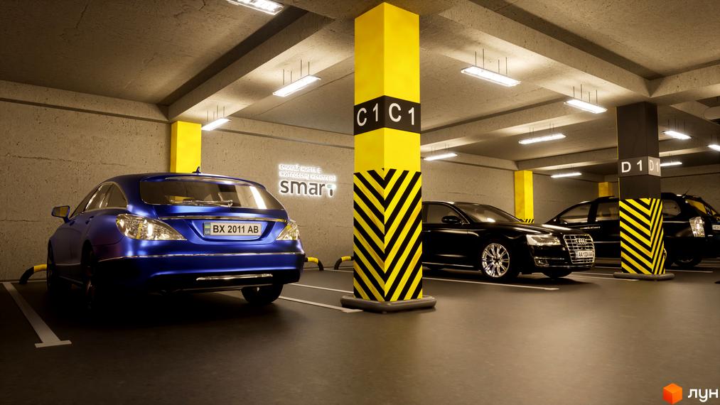 Паркінг в Житловому комплексі Smart з автомобілями та жовтими колонами. На стіні нанесено логотип проєкту.
