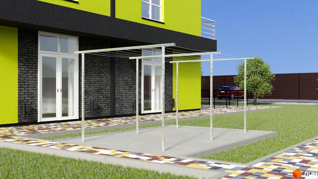 Зображення фасаду будівлі ЖК Калиновий Квартал з великими вікнами та терасою. На передньому плані – доглянута прибудинкова територія з газоном.