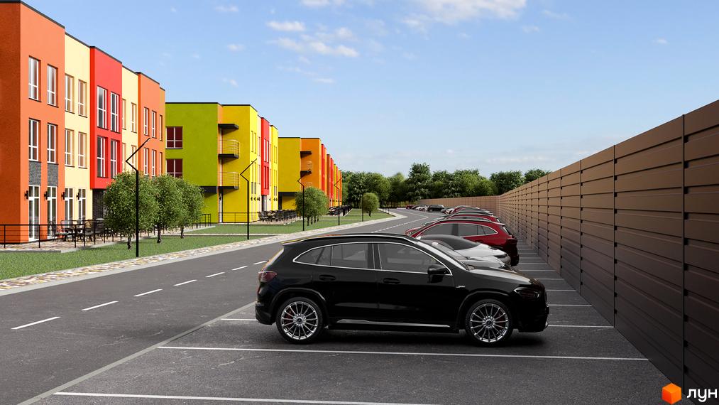 Яскраві будинки житлового комплексу Калиновий Квартал з парковкою та зеленими насадженнями, що створюють затишну атмосферу.