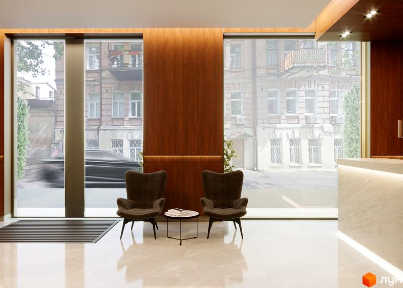 Апарт-готель „На Тургенєвській, 17а“ – це стильний комплекс із двома кріслами та журнальним столиком біля великих вікон, що виходять на вулицю.