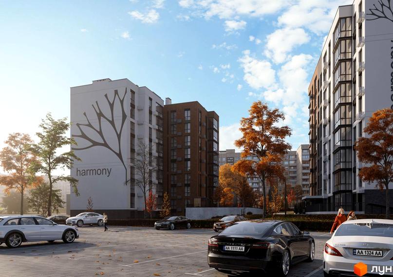 Зображення фасаду та прибудинкової території Житлового комплексу HARMONY for you. На передньому плані парковка з автомобілями.