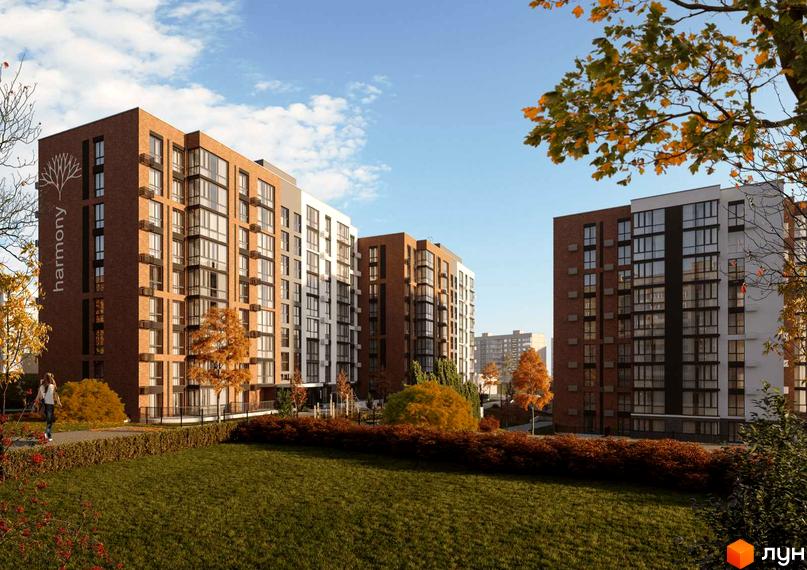 Зображення фасаду і прибудинкової території Новобудови HARMONY. На передньому плані газон з декоративними кущами.