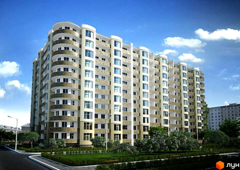 Багатоповерхова новобудова Победа з вигнутим фасадом та численними балконами. Прибудинкова територія має зелені насадження та дорогу.