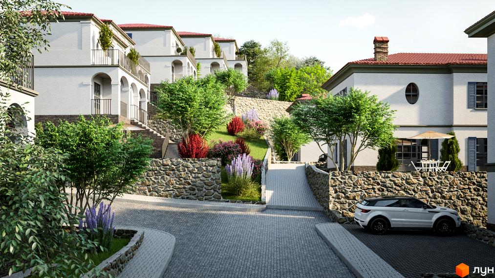 Білі будинки з червоними дахами в Котеджному містечку FAMILY BOTANIQ GARDEN. На території багато зелені, бруківка та кам'яні стіни.