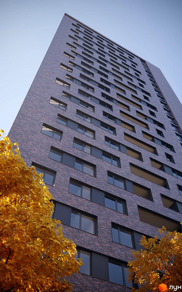 Зображення фасаду Новобудови MAISON з великою кількістю вікон. На передньому плані дерева з жовтим листям.