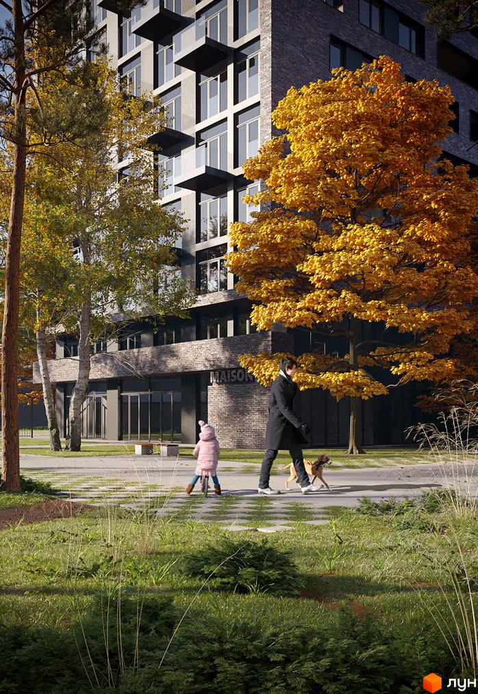 Зображення фасаду та прибудинкової території Житлового комплексу MAISON. На передньому плані пішохідна алея з деревами та газоном.