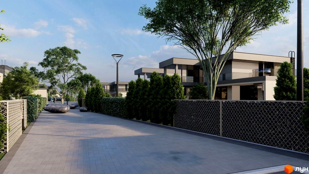 Котеджне містечко Ariel Village з сучасними будинками та доглянутою прибудинковою територією з деревами та бруківкою.