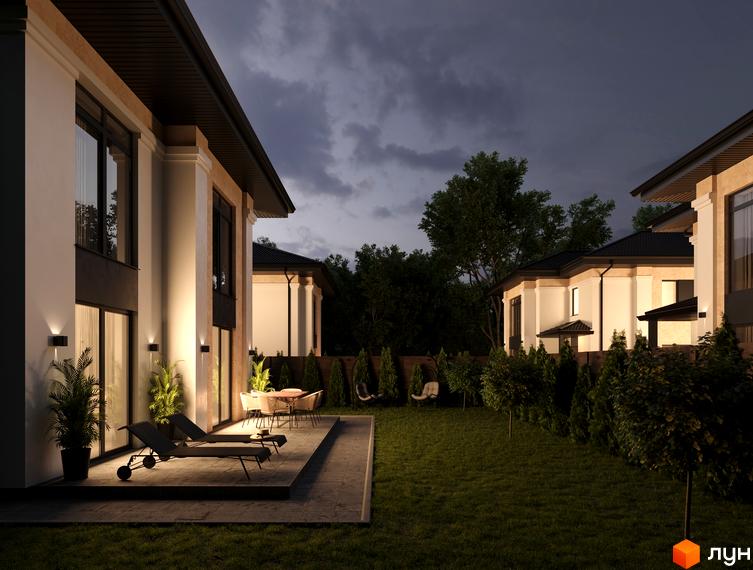 Котеджне містечко КМ Sandstone Residence з підсвіченими фасадами та затишною прибудинковою територією з газоном та рослинністю.