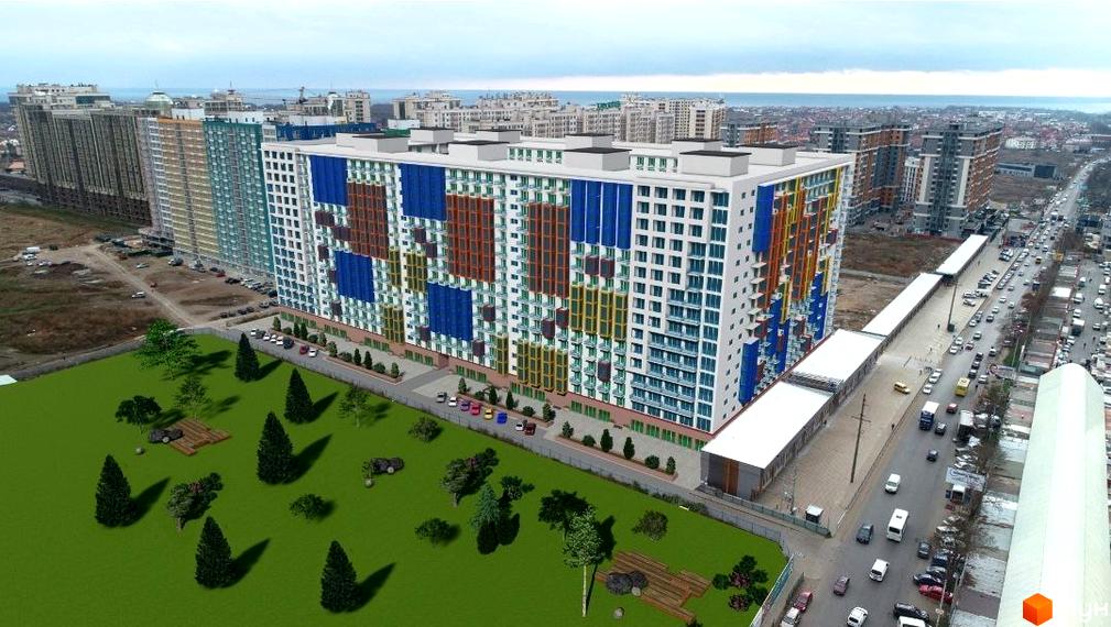 Зображення фасаду та прибудинкової території Новобудови Калейдоскоп 2. Навколо будинку є зелена зона з деревами та парковка.