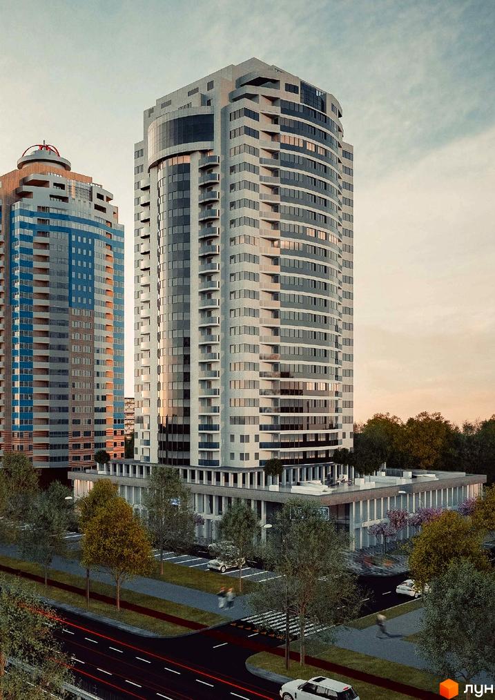 The First House – сучасний житловий комплекс з вигнутим фасадом, великою кількістю скління та балконів. Територія комплексу озеленена деревами, є парковка та дорога з автомобілями.