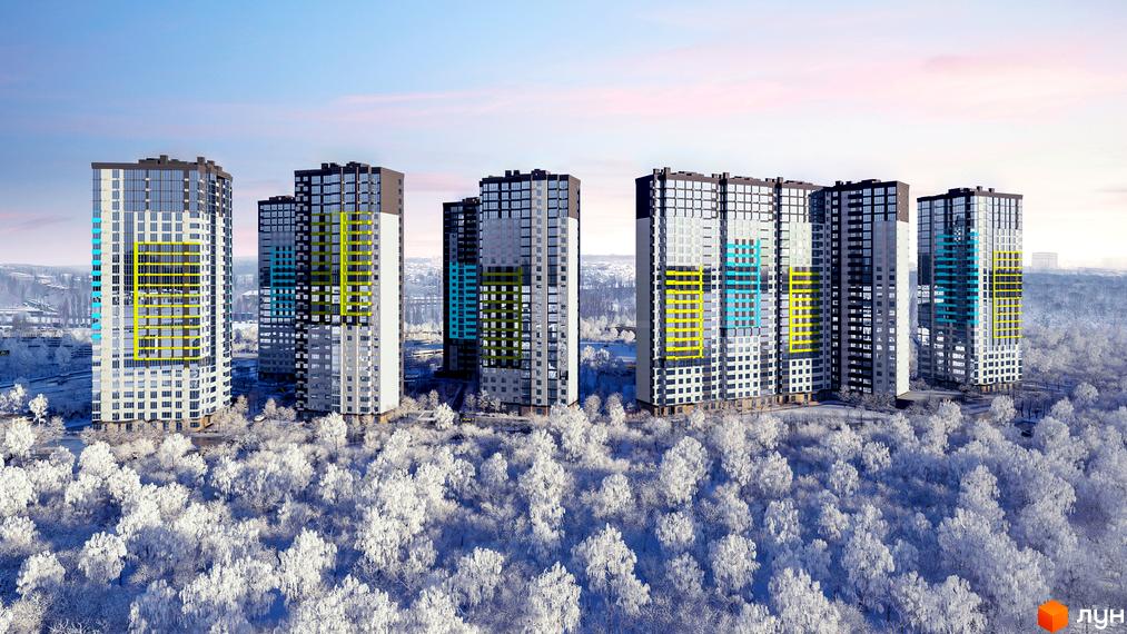 Зовнішній вигляд новобудови ЖК Теремки з яскравими елементами на фасаді та засніженим лісом навколо. Комплекс розташований серед зимового пейзажу.