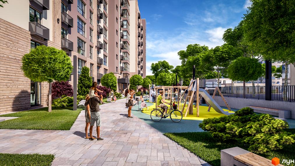 Висотна будівля Житлового комплексу PARKOVIY з великими вікнами та балконами, облаштована прибудинкова територія з дитячим майданчиком та зеленими насадженнями.