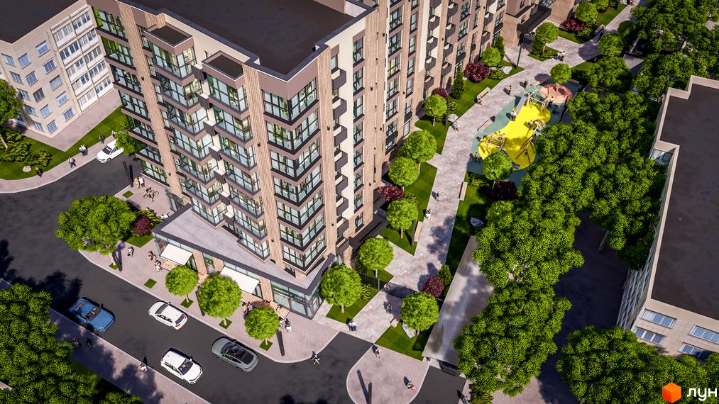 Висотна будівля житлового комплексу PARKOVIY з панорамними вікнами та прибудинковою територією з дитячим майданчиком та зеленими насадженнями.