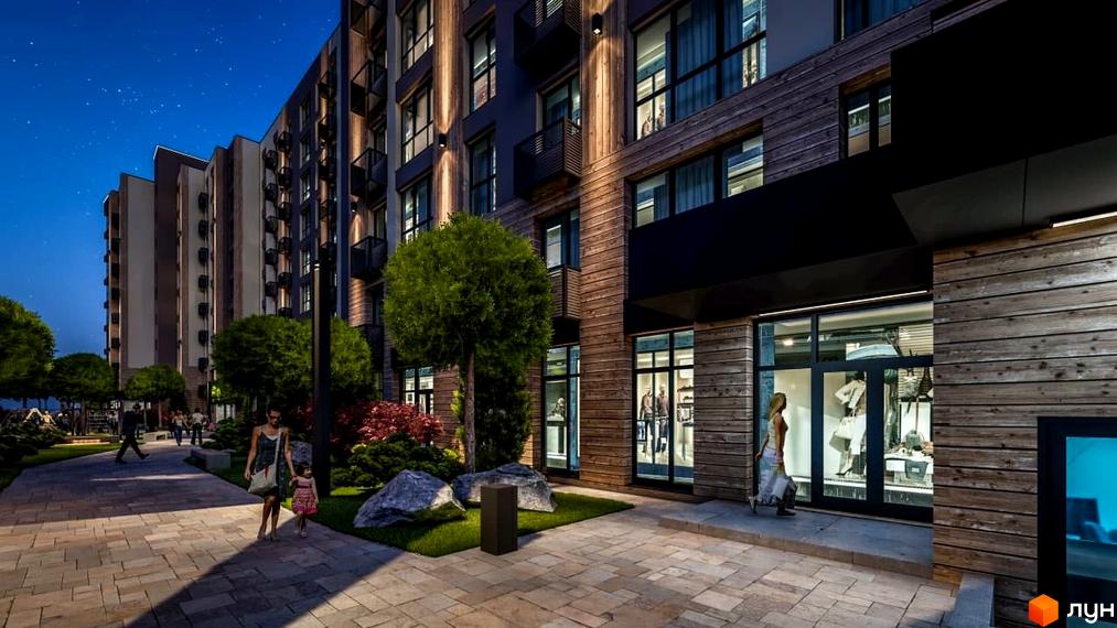 Фасад багатоповерхового будинку ЖК PARKOVIY з дерев'яним оздобленням та великими вікнами. На передньому плані доглянута прибудинкова територія з пішохідними доріжками та зеленими насадженнями.