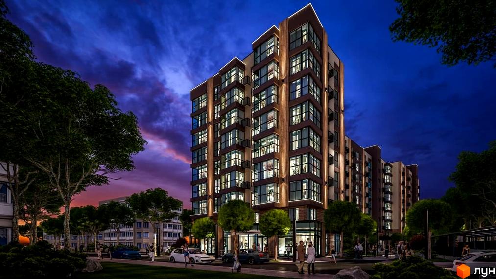 Висотна будівля ЖК PARKOVIY з великими вікнами та підсвіткою. Навколо будинку розташовані дерева, тротуар та припарковані автомобілі.