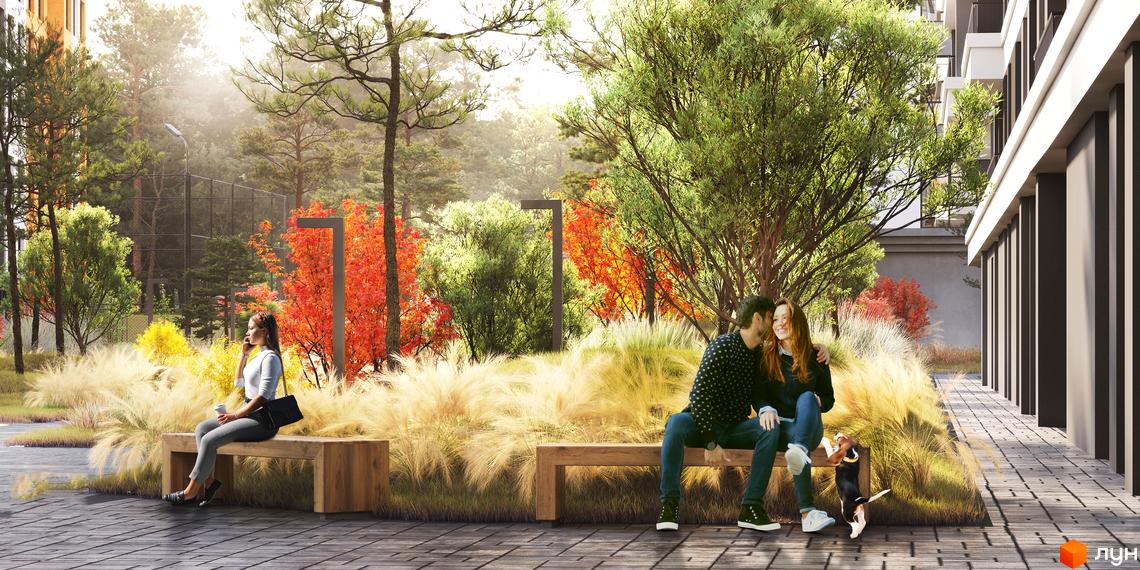 Житловий комплекс MAVERICK RESIDENTIAL COMPLEX з прибудинковою територією та зонами відпочинку. Люди та собака на лавці серед зелені та квітів.