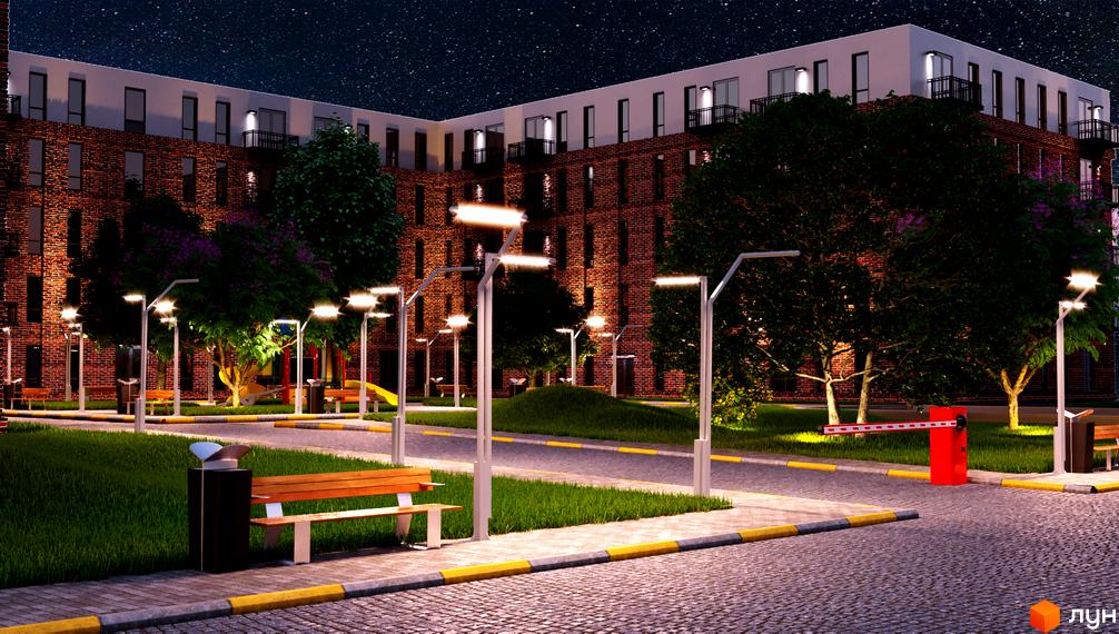 Зображення фасаду та прибудинкової території Житлового комплексу Status Residence вночі. Вигляд освітленого двору з лавками та ліхтарями.