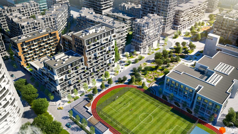 Вигляд ЖК UNIT.Home: багатоповерхові будинки з балконами та терасами, поруч спортивне поле, зелені насадження та пішохідні алеї.