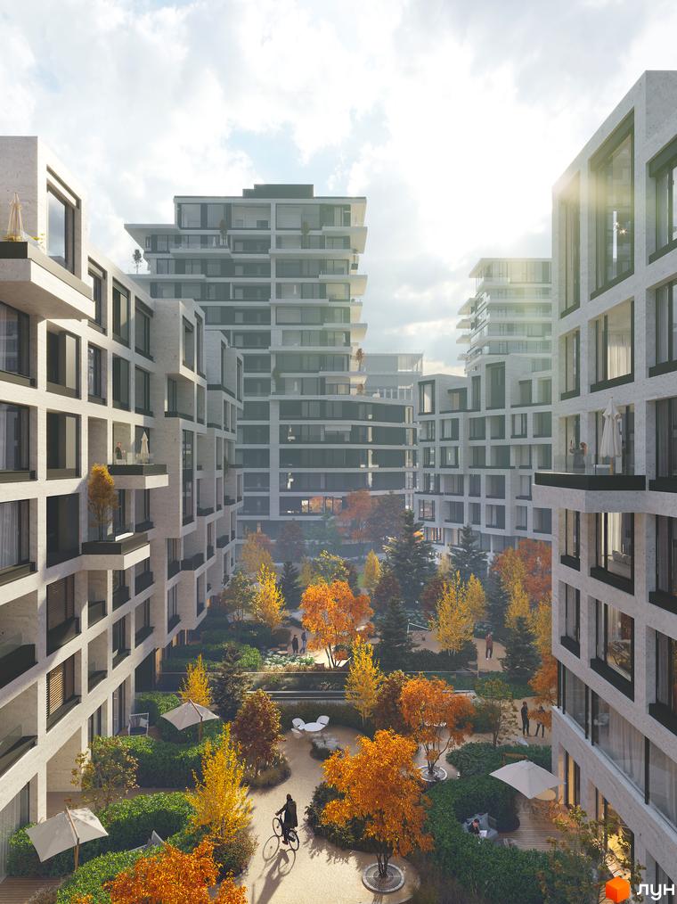 Житловий комплекс UNIT.Home: багатоповерхові будинки з світлими фасадами та балконами, оточені зеленим двором з осінніми деревами.