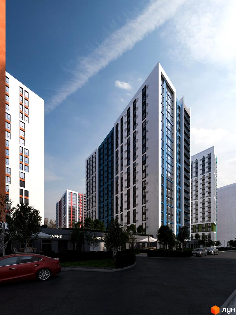Зовнішній вигляд новобудови ЖК Акварель-9 з білими та синіми фасадами, вікнами та прибудинковою територією з деревами та автомобілями.