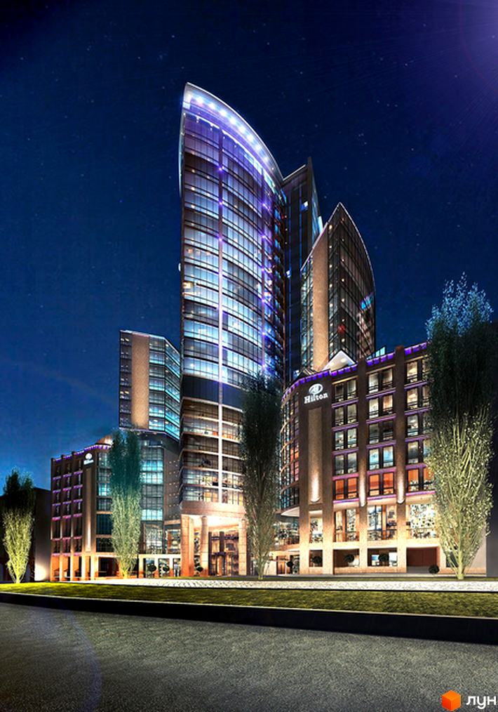 Житловий комплекс H-Tower з сучасною архітектурою та прибудинковою територією, освітленою вночі.