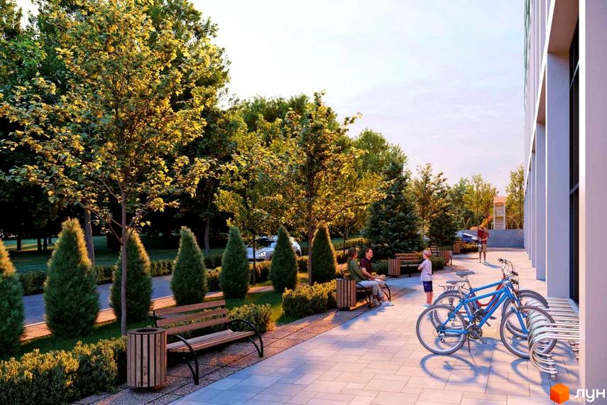 БФК TOPOL TOWN: фасад будинку та прибудинкова територія з деревами, лавками та велосипедами. Зелена зона для відпочинку мешканців.