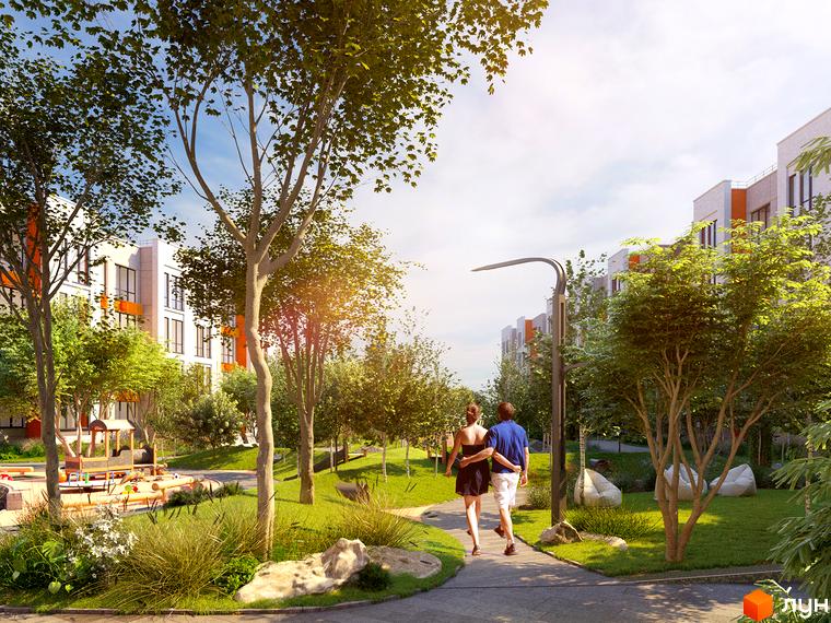Житловий комплекс Найкращий квартал-2: фасади будинків з помаранчевими акцентами та зелена прибудинкова територія з місцями для відпочинку.