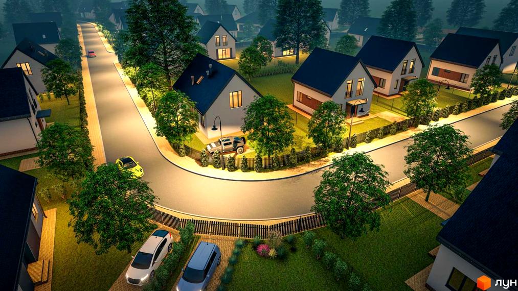 Зображення Котеджного містечка Літо з будинками з темними дахами та зеленими насадженнями навколо. На подвір'ї стоять автомобілі.