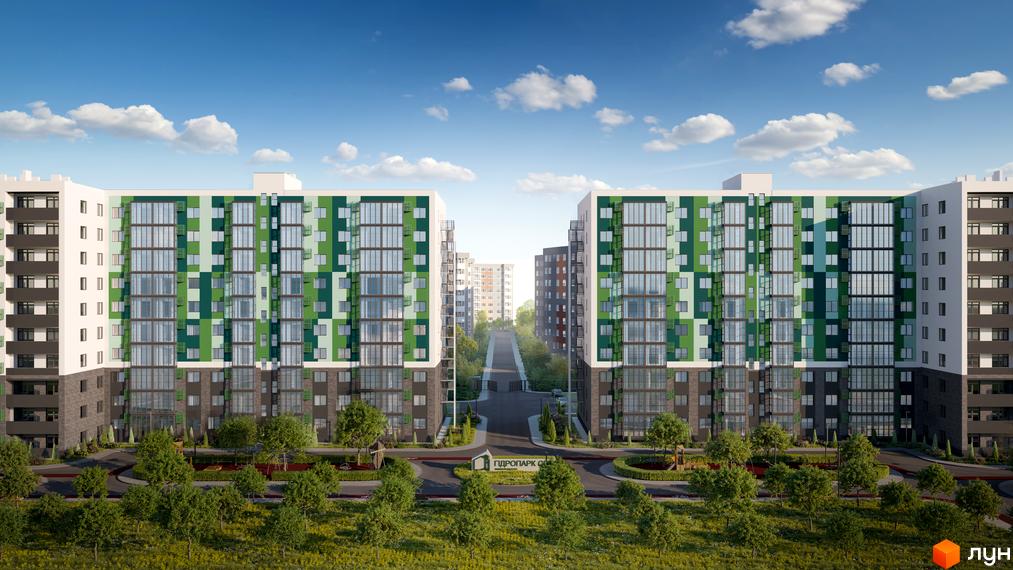 Два будинки житлового комплексу Гідропарк Сіті з фасадами у зелених тонах. На прибудинковій території дерева та зелені насадження, блакитне небо з хмарами.