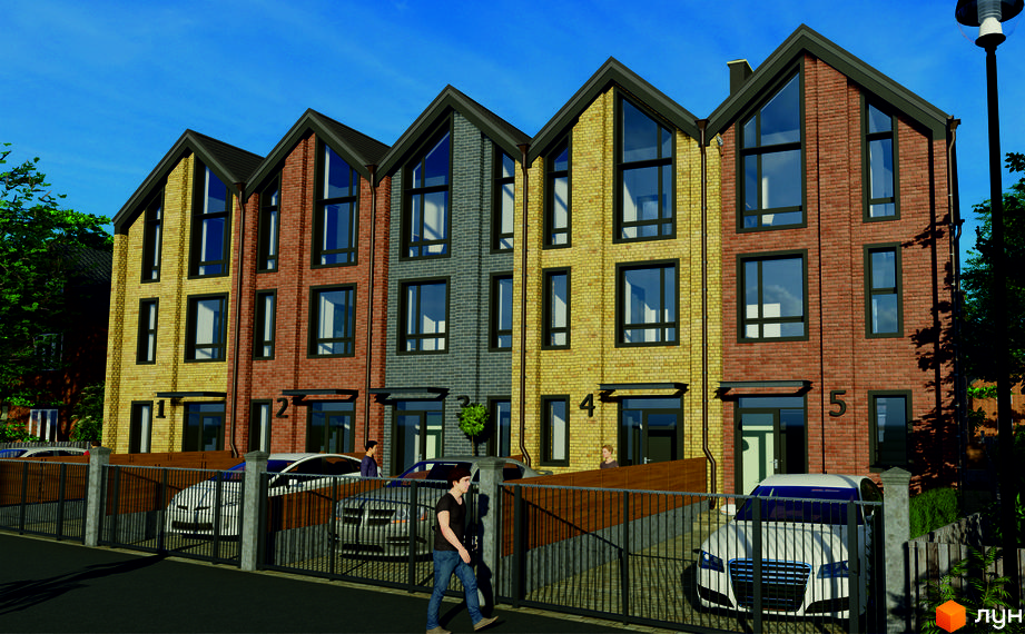 Ряд триповерхових таунхаусів з цегляними фасадами різних кольорів та великими вікнами. Перед будинками огороджена парковка з автомобілями.