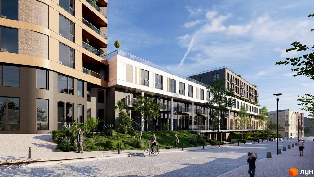 Зовнішній вигляд новобудови ЖК PRAUD select з елементами цегляного фасаду та скляними балконами. На прибудинковій території облаштовані зелені зони та пішохідні доріжки.