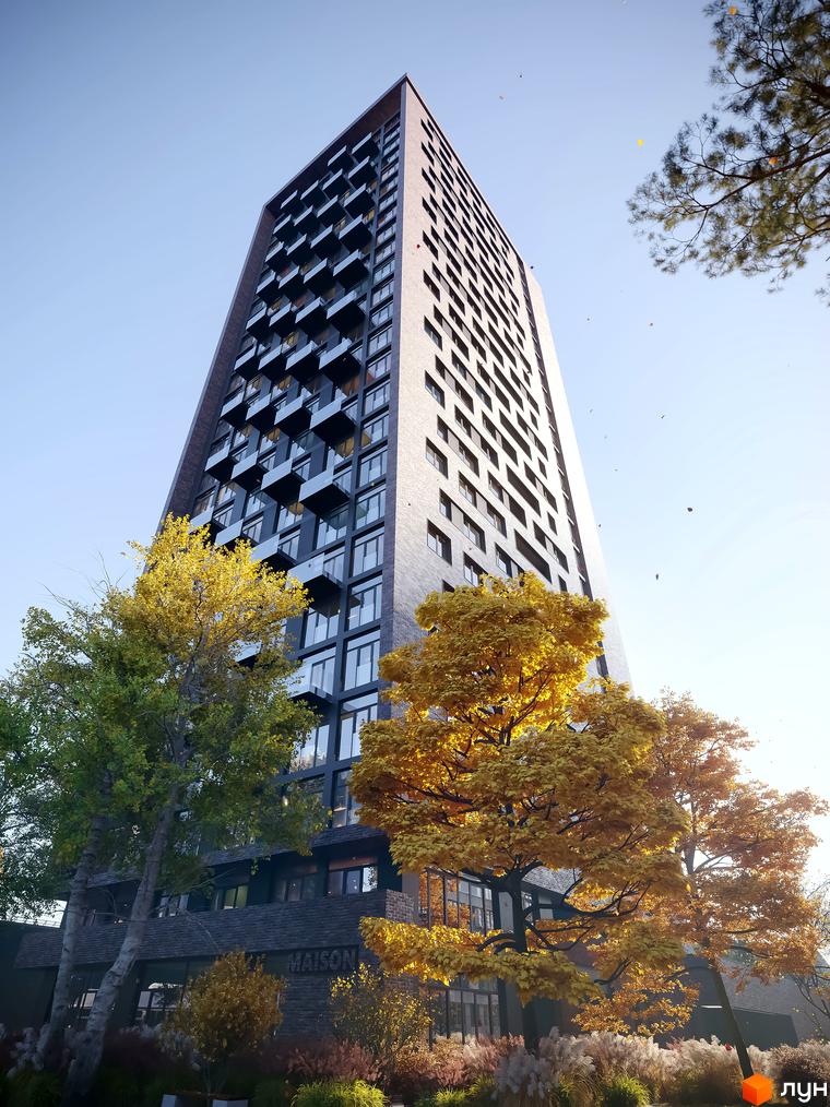 Висотна новобудова ЖК MAISON з великими вікнами та балконами. На передньому плані дерева з жовтим листям, що створюють осінню атмосферу.