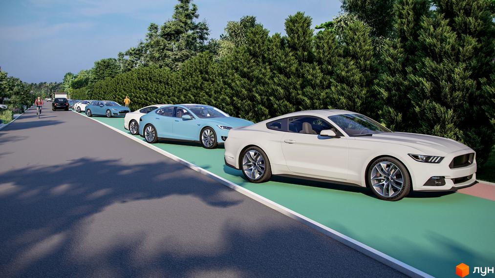 Котеджне містечко Marinero Residence з автомобілями та пішохідною зоною поруч із зеленими насадженнями.