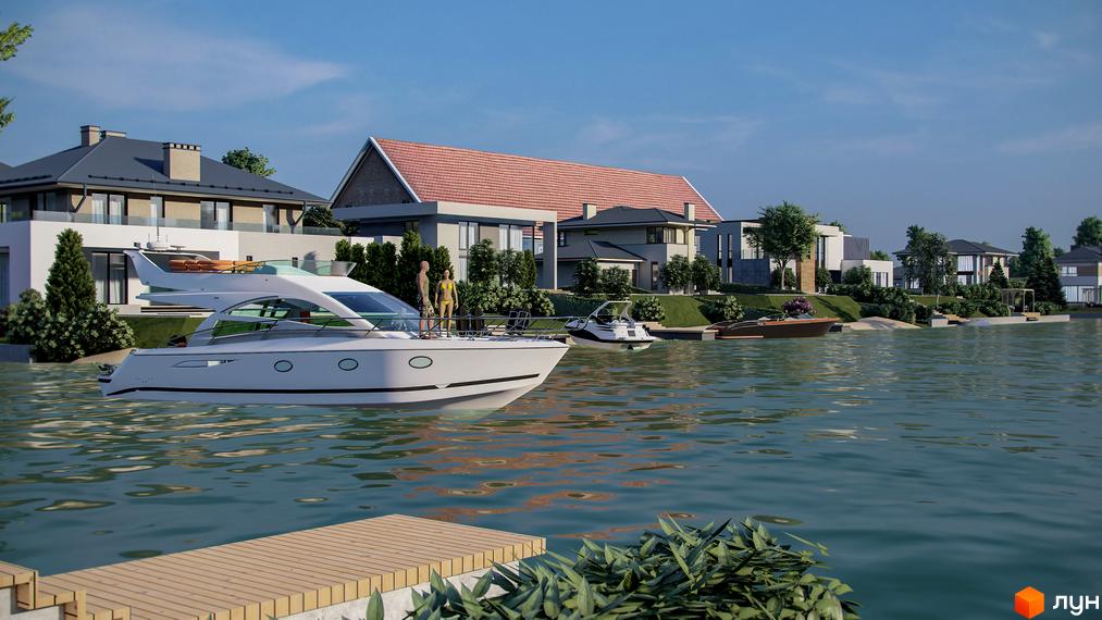 Котеджне містечко Marinero Residence з білими яхтами на воді та сучасними будинками на березі. Навколо багато зелені та блакитне небо.