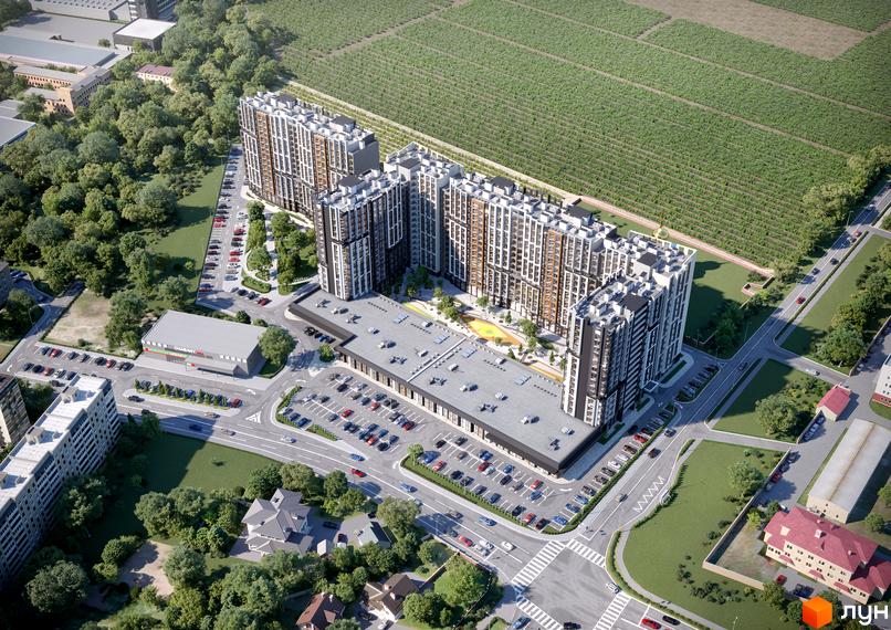 Житловий комплекс NEXT з висоти пташиного польоту, що демонструє багатоповерхові будинки та прибудинкову територію з парковкою та зеленою зоною.