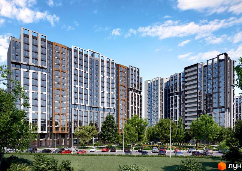 Високоповерхові будинки ЖК NEXT з панорамними вікнами та фасадами у світлих тонах. На території комплексу є парковка та зелені насадження.