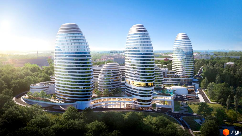 Багатоповерхові будівлі з округлою формою та горизонтальними смугами на фасадах. На території комплексу є зелені насадження, парковка та під'їзди.