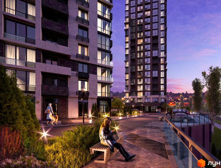 Зображення фасаду та прибудинкової території Новобудови CITY HUB. На передньому плані лавка, на якій сидить дівчина.